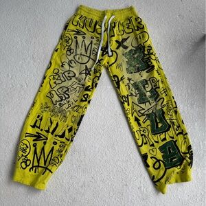 Yellow and green graffiti sweatpants hustlers Klub brand.